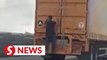 Police on the hunt for man seen clinging to moving lorry in Kulai