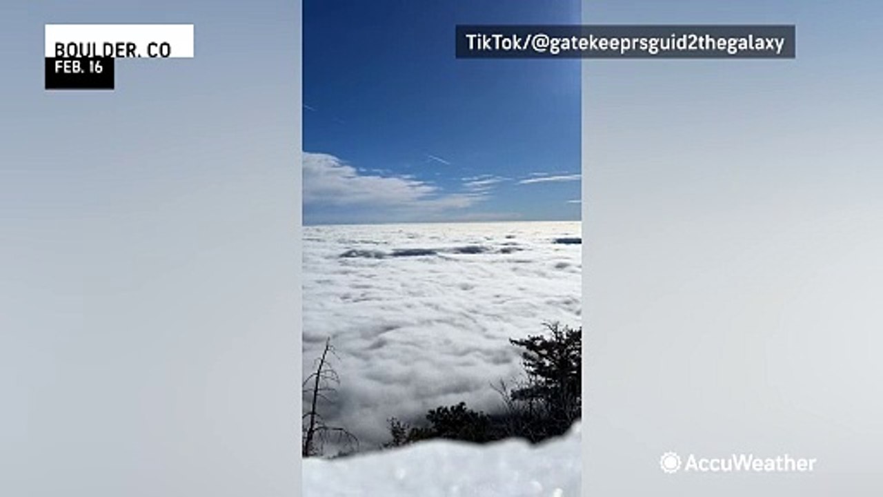 Thick clouds flow like water over Colorado
