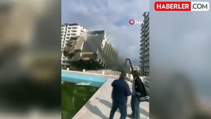 İskenderun'da iş makinesinin darbesiyle 13 katlı bina yıkıldı