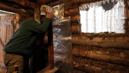 Walking into the forest hut alone, in the middle of a cold winter with heavy snowfall