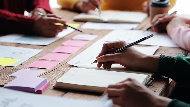 vecteezy_financial-analysts-analyze-business-financial-reports-on-a_21599299