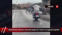 Mersin'de motosikletle yolculuk sırasında başka bir motoru kucağında taşıdılar