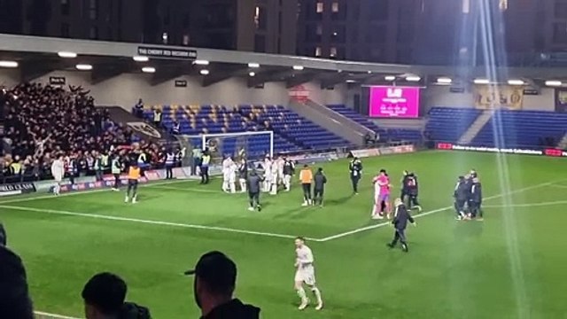 Crawley Town manager Scott Lindsey and players celebrate with fans after AFC Wimbledon win