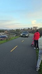 Car Speeds Down Pedestrian Trail