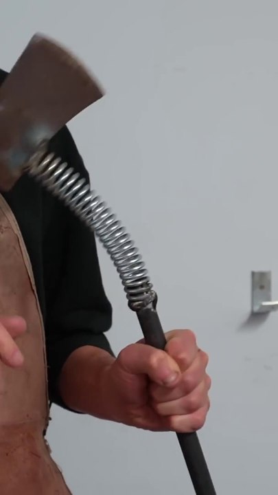 He made a spring axe from scraps in an amazing way