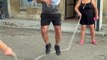 Boy Smiles Big While Playing Jump Rope With Dad