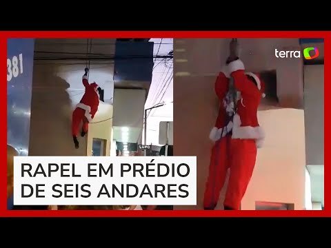 Papai Noel tenta fazer rapel em prédio, enrosca barba em fios e acaba pendurado em MG