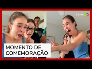 Video herunterladen: Jovem é aprovada em medicina e reação emocionante da família viraliza