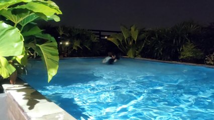 The twins swim at night