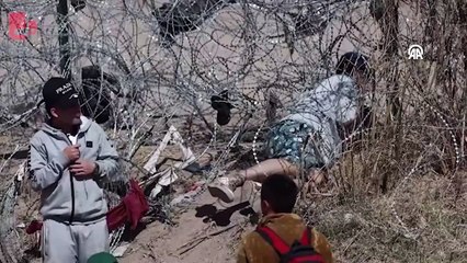 Göçmenler ABD'ye geçmek için tel örgüleri kesiyor