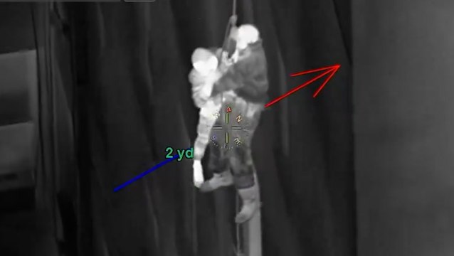 Firefighters use rope to rescue people dangling from windows of burning Harlem building