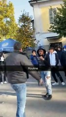 Student wrestles with teacher in the school parking lot