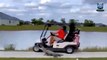 Shocking moment alligator chases after golfers and nearly causes crash as fans say ‘dinosaurs are coming for us’