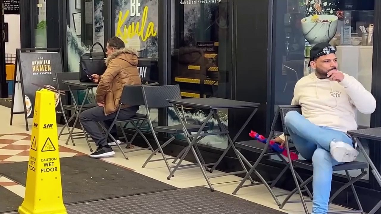 Water gun sprayon strangers prank by joker pranks