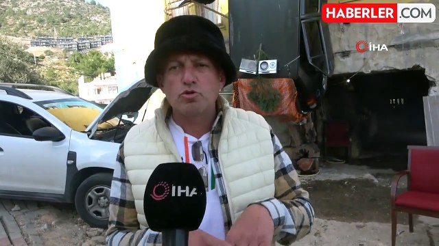 Antalya'da bir vatandaş, kazaya karışan aracını iple binadan aşağıya sarkıttı