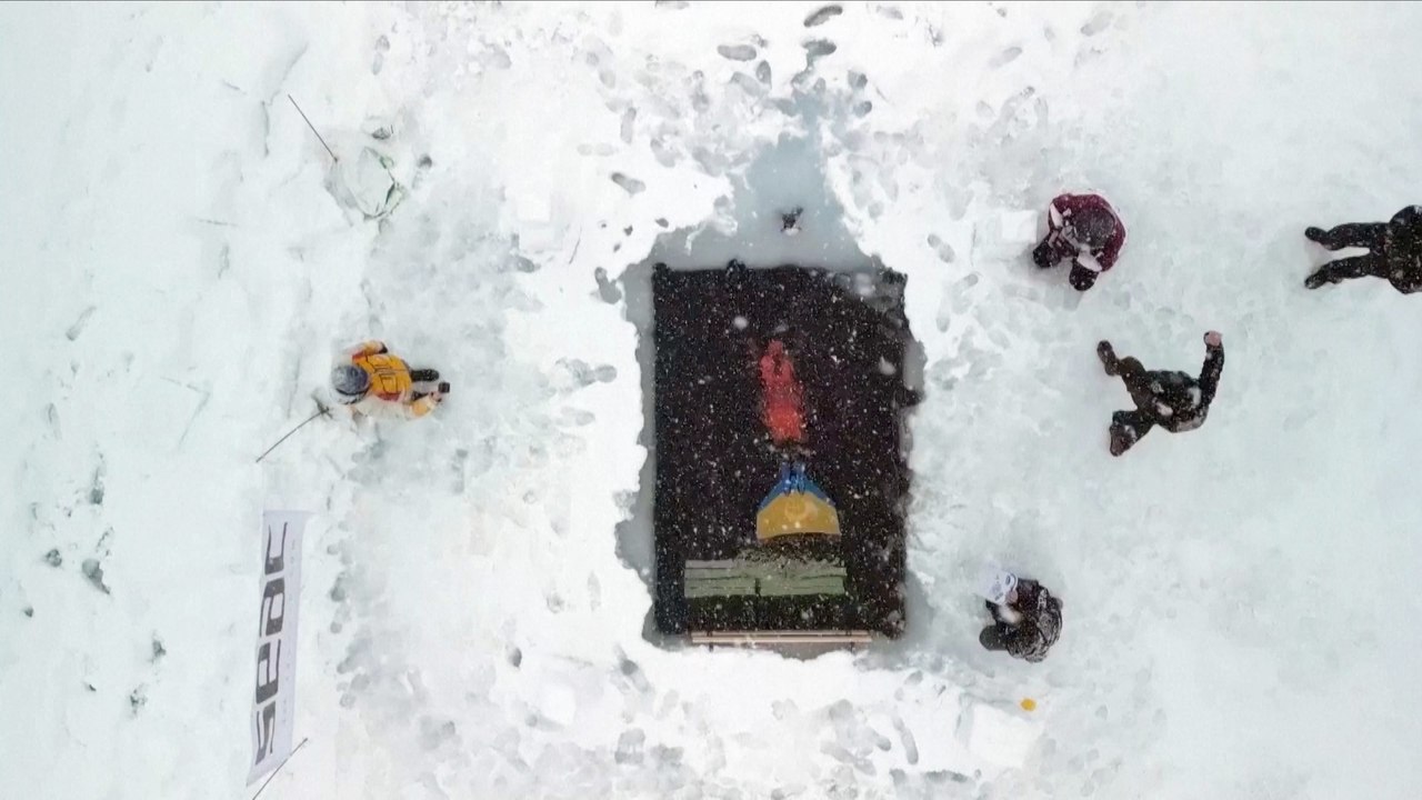 Must See! This is the Moment a Free Diver Sets a New Guinness World Record by Swimming Hundreds of Feet Under a Frozen Lake