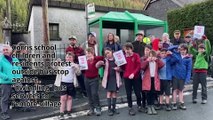 Corris school children and residents protest outside bus stop against “dwindling” bus services to remote village