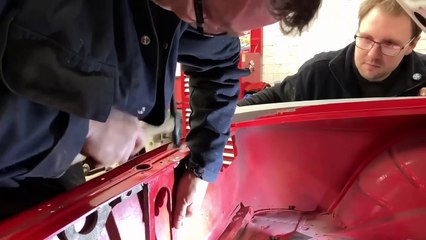 Dent pulling on a classic Lancia Sports Coupe