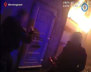 Officers lead people to safety after arson in Birmingham