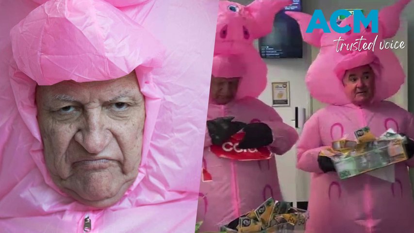 Aussie politicians Bob Katter and Andrew Wilkie paused the squealing and dealing in Parliament to don inflatable pig suits in a bizarre protest against the grocery giants.
