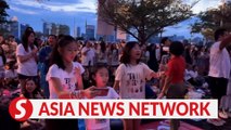 The Straits Times | Taylor Swift in Singapore: Fans outside the National Stadium sing along with the concert