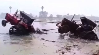 How to pull out stuck tractor in deep muddy waters