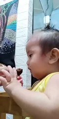 Cute baby eats cookie