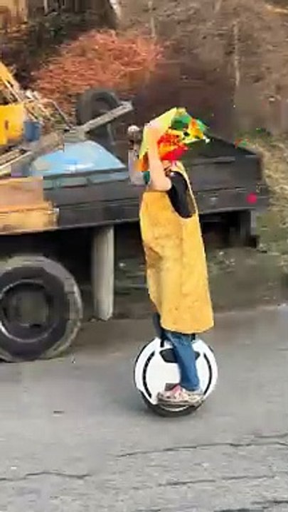Boy In Taco Costume Rolls Down Street On Electric Unicycle