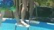 Woman Hilariously Falls Back While Trying to Get Her Son Into Pool