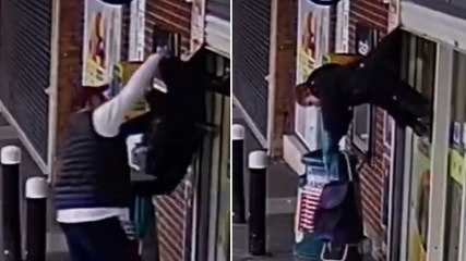 Woman left dangling upside down after getting caught in shop shutter