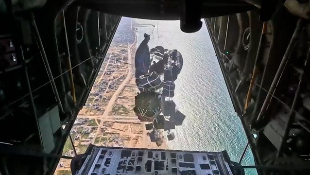Moment US military airdrop new aid packages onto Gaza beach