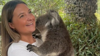 Woman is delighted to hold a cute koala in her arms for the first time *Wholesome*