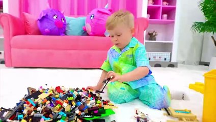 Oliver and Roma pretend play with toy washing machine