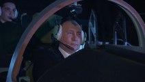 Putin tests out flight simulator during Russian aviation school visit