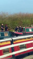 Police descend upon boat on Wheelton Canal to check for 'severed hand'.