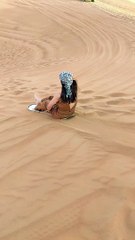 enjoy a sand boarding at Dubai desert safari withAl Qudra