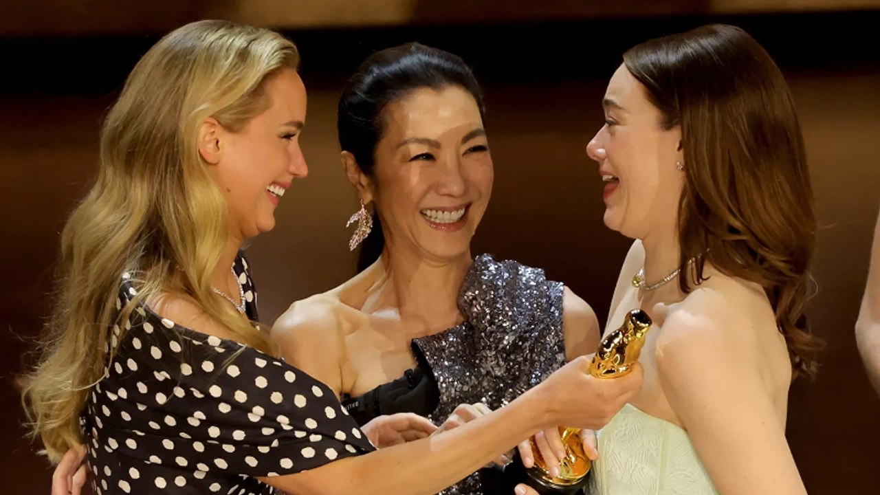 Why Michelle Yeoh Gave Emma Stone's Oscar to Jennifer Lawrence THR