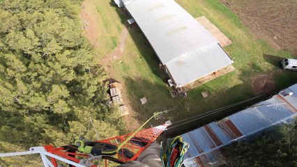 Worker Assembles Telecommunications Tower
