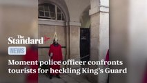 Armed police officer confronts American tourists for heckling member of King's Guard