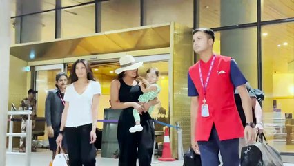 Priyanka Chopra carries daughter Malti Marie in arms as they arrive in Mumbai; pose for paps