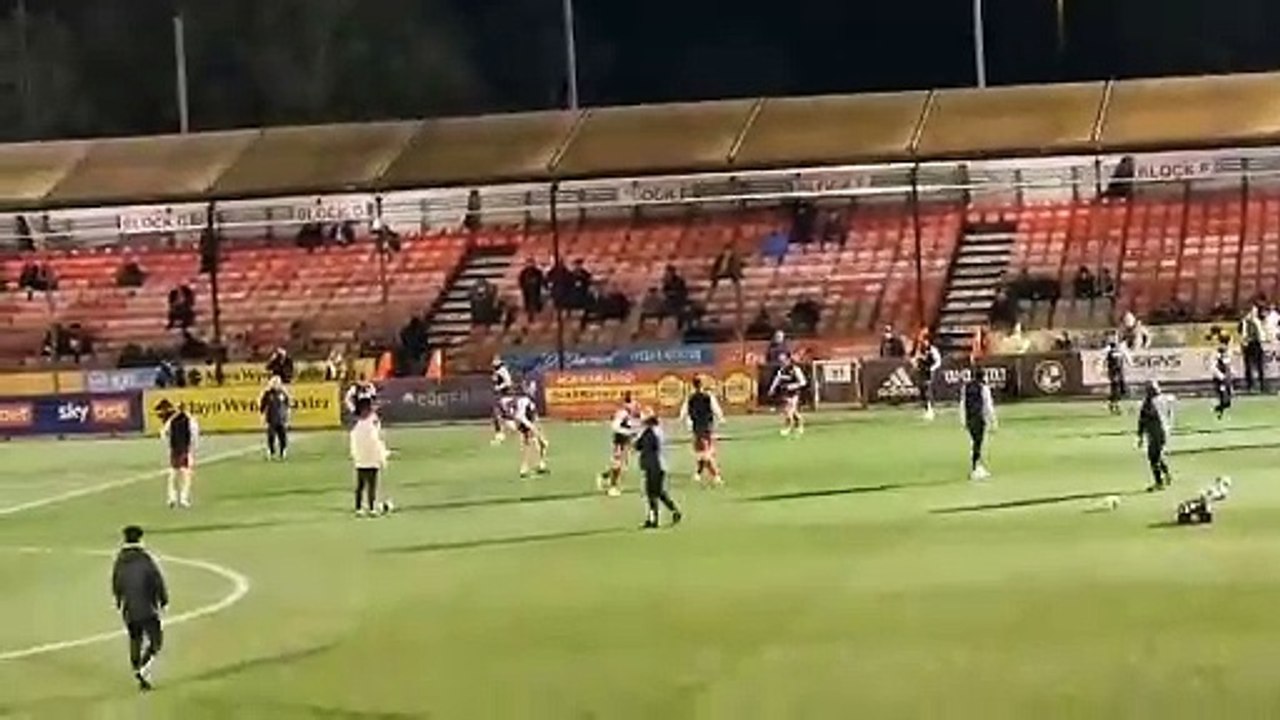 Crawley Town players warm up before crunch match vs Stockport County