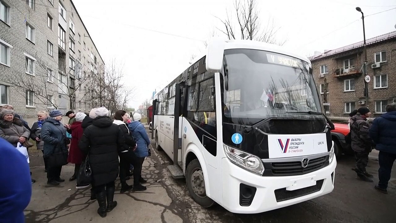 Voters cast their ballots on a bus in the Russian-held Donetsk region