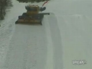 Snowboarder Jumps Over Groomer