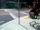 Drunk girls face-plant on to hard concrete from shopping cart