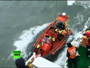 Download Video: Video of crew trapped on capsized ship, coast guard rescue operation