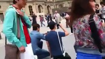 SuJu and SHINee dancing Sorry Sorry and Ring Ding Dong in front of Lourve