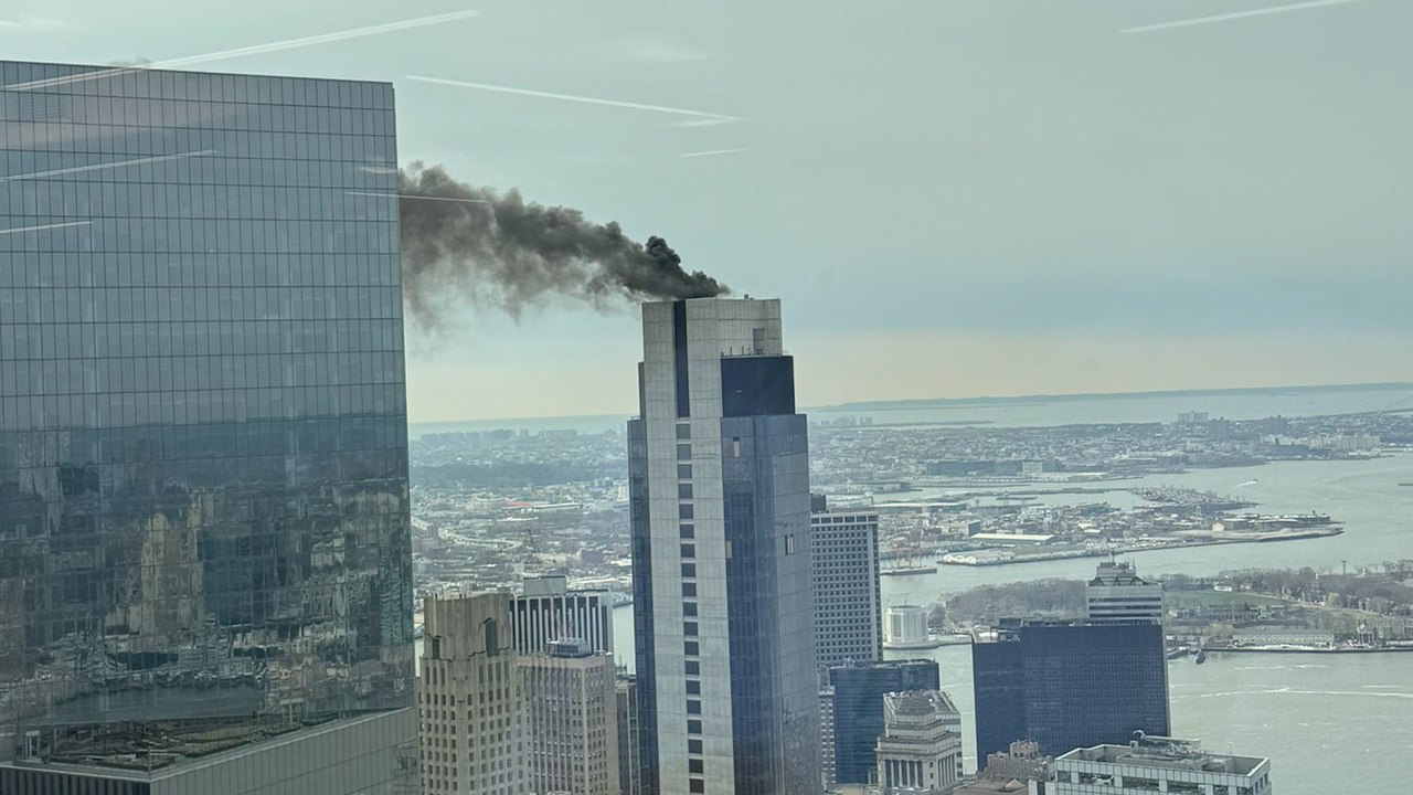 Black smoke billows from building as Manhattan skyscraper catches fire