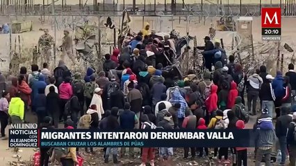 Migrantes intentan derribar valla de púas en la frontera de Texas