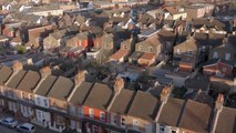 How will house prices in Wales be affected by the interest rate freeze?