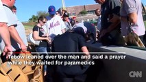 Tim Tebow prays over fan who appears to have a seizure